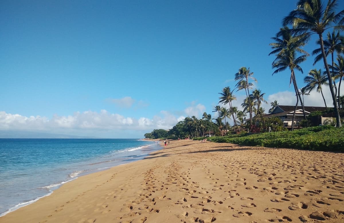 Footsteps in the sand at Kāʻanapali Beach in Maui