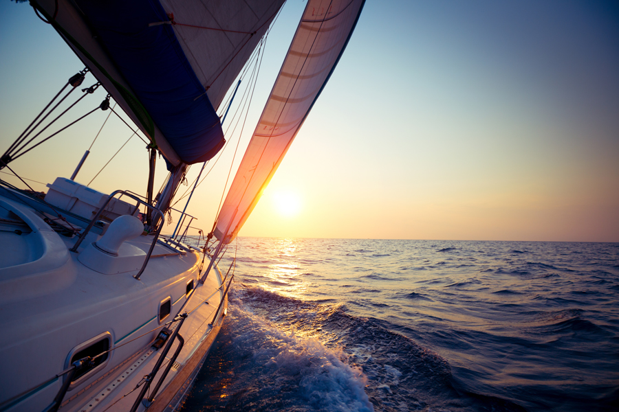Sailboat on the water at sunset off the coast of Maui